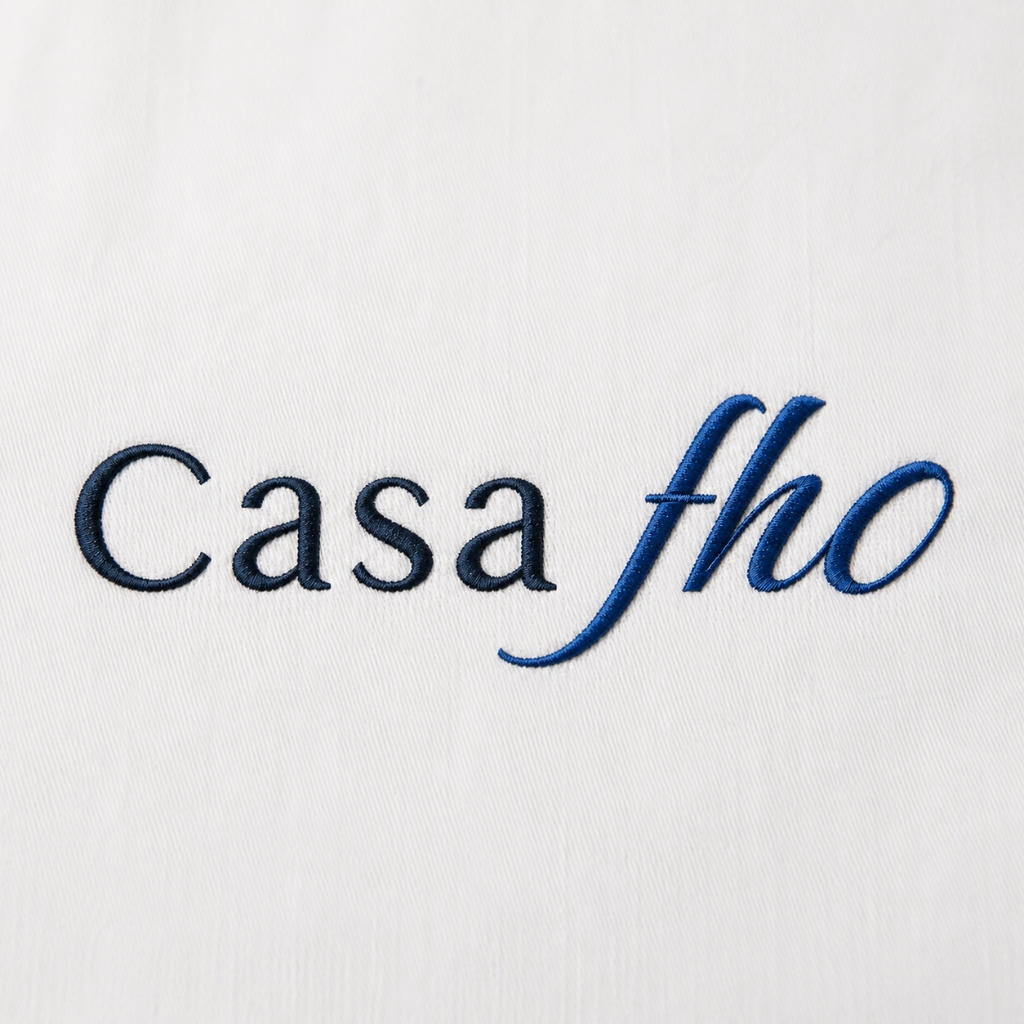 Close-up professional photography of a high-quality embroidered corporate polo shirt.